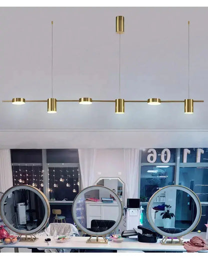 Chandelier by Decorbites brass LED fixture with long rod and cylindrical/round light modules on Tampa Home & Garden Store