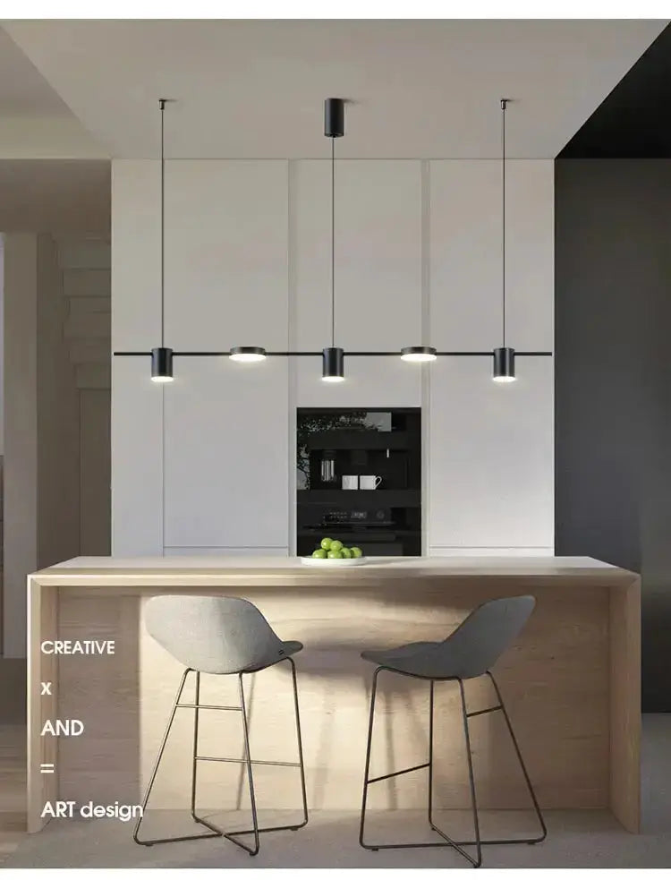 Chandelier Decorbites modern black metal LED with four pendants over light wood island on Tampa Home & Garden Store