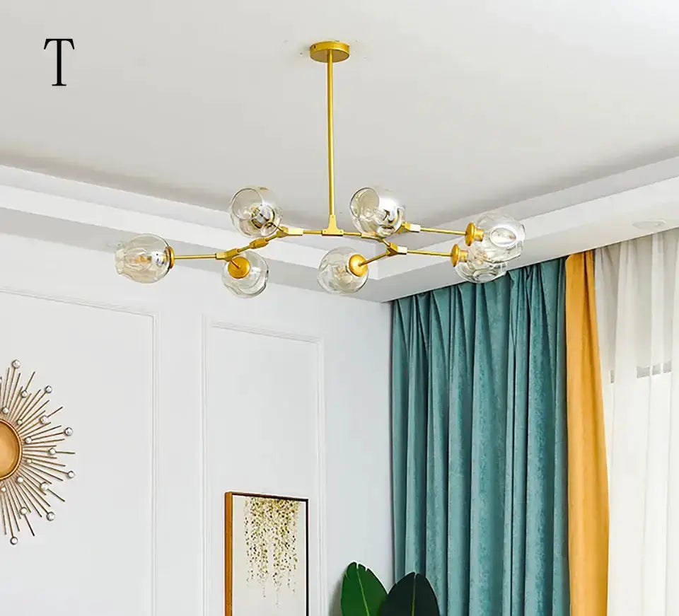 Decorbites Nordic chandelier with clear glass globes and brass finish on Tampa Home & Garden Store