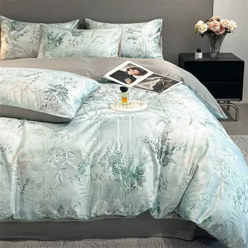Pastel floral satin silk duvet cover set by Decorbites on bed with pale blue botanical print on Tampa Home & Garden Store