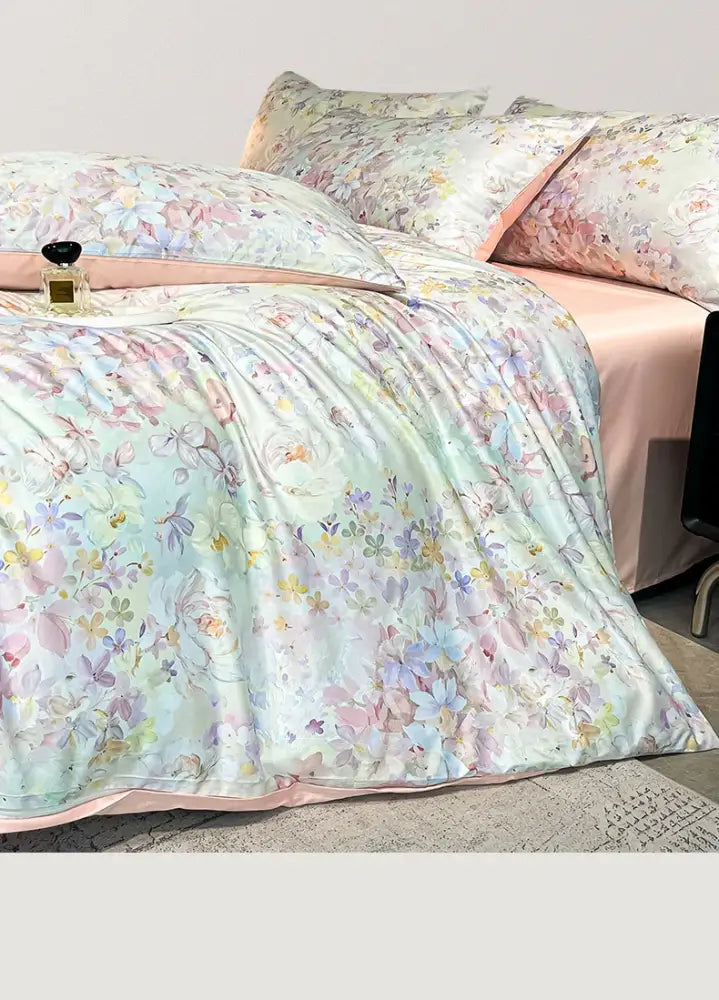 Pastel floral satin silk duvet cover set by Decorbites on bed with pink sheets on Tampa Home & Garden Store