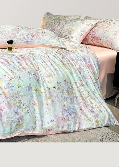Pastel floral satin silk duvet cover set by Decorbites on bed with pink sheets on Tampa Home & Garden Store