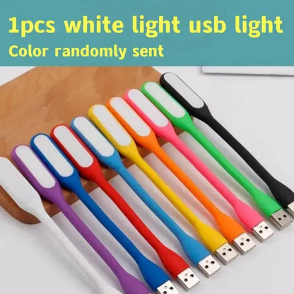 Row of colorful USB LED light strings with white tips on a wooden surface on Tampa Home & Garden Store