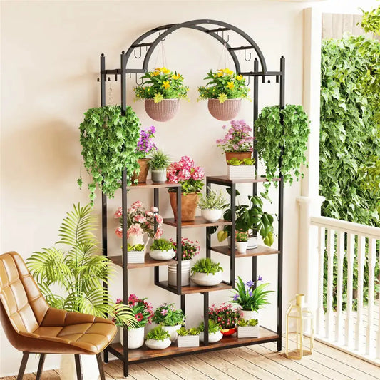 Modern Black Metal and Wood 5 Tier Plant Stand with hanging baskets and lush potted plants on Tampa Home & Garden Store