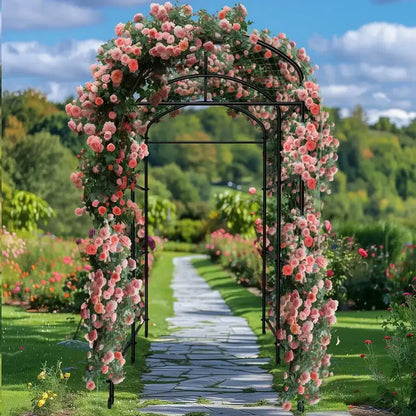 Tall black metal arched garden plant trellis draped in pink roses on Tampa Home & Garden Store