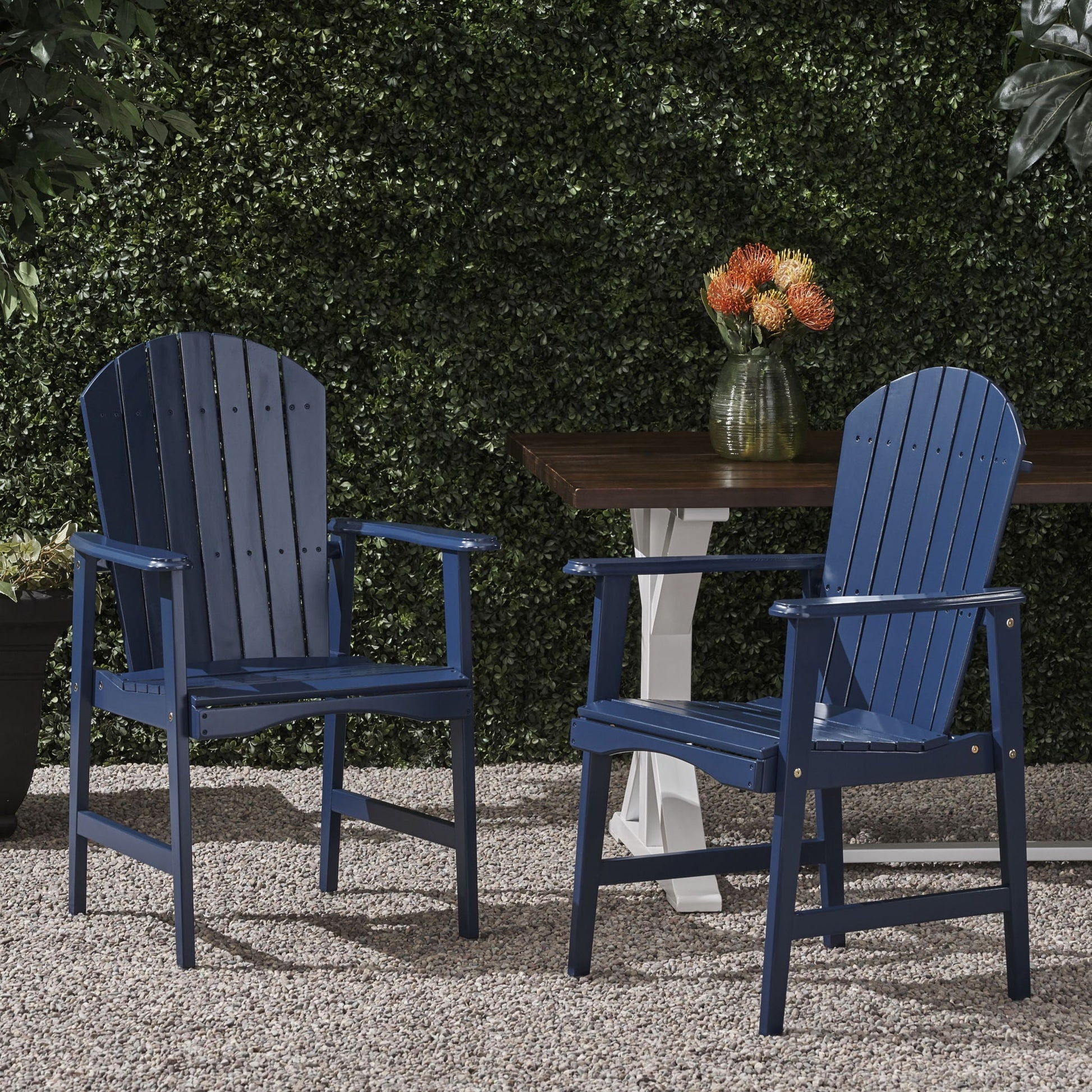 Outdoor Adirondack dining chairs set of 2 in blue with a vase of flowers on a table on Tampa Home & Garden Store