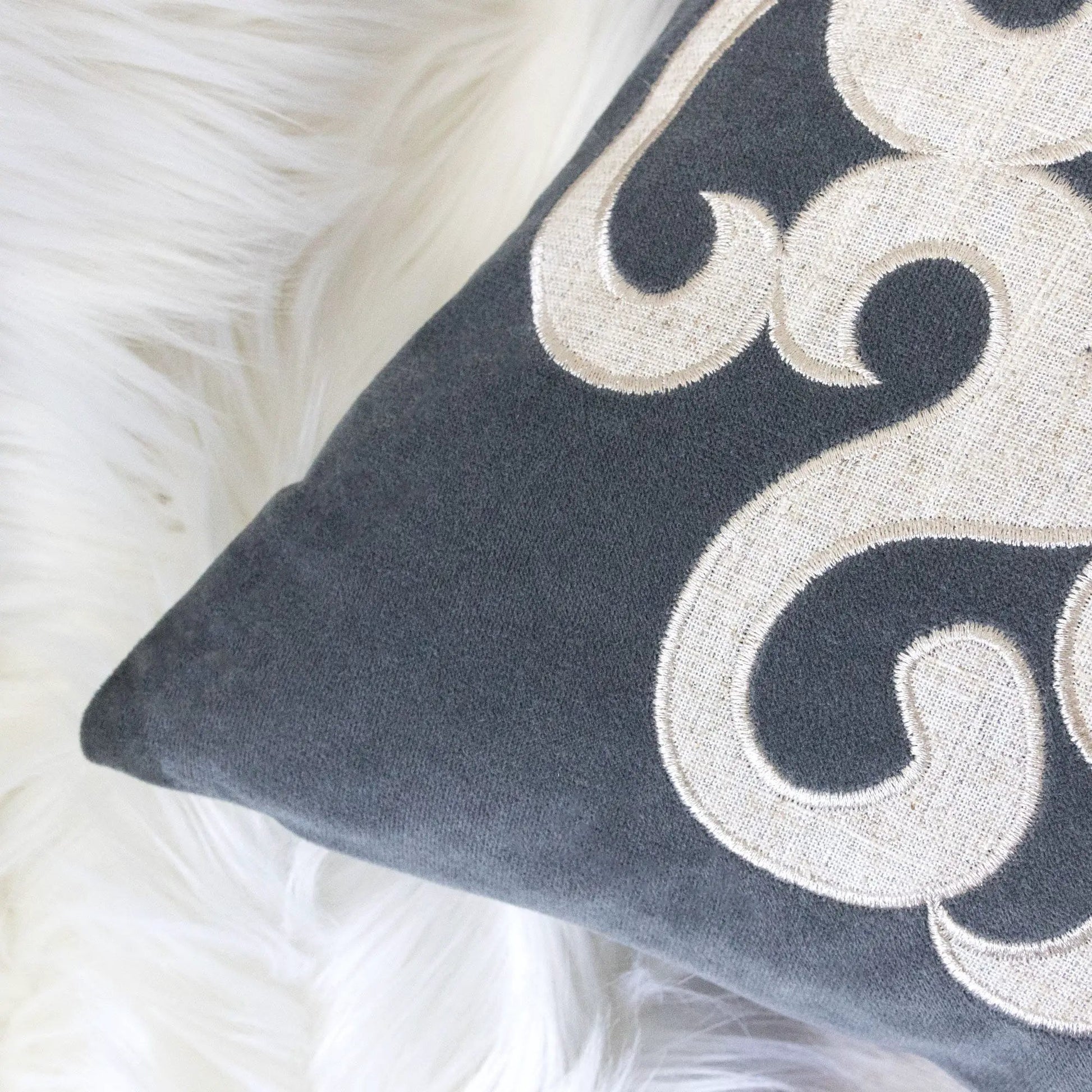 Dora pillow cover with matching back, dark navy fabric with beige embroidered scroll motif on Tampa Home & Garden Store