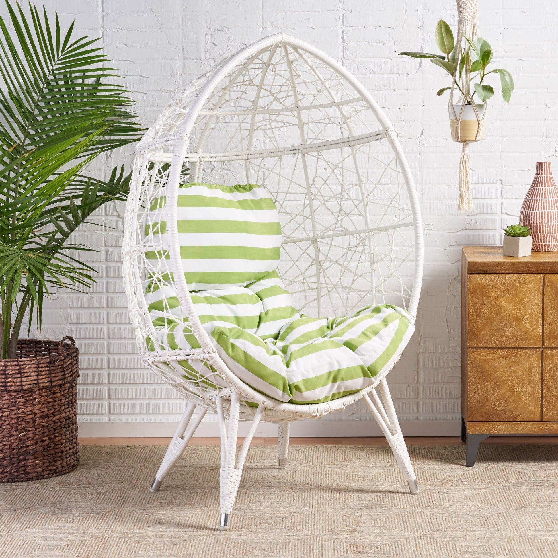 Cosmos teardrop chair by HouseOfZazla, white wicker with green striped cushion on Tampa Home & Garden Store