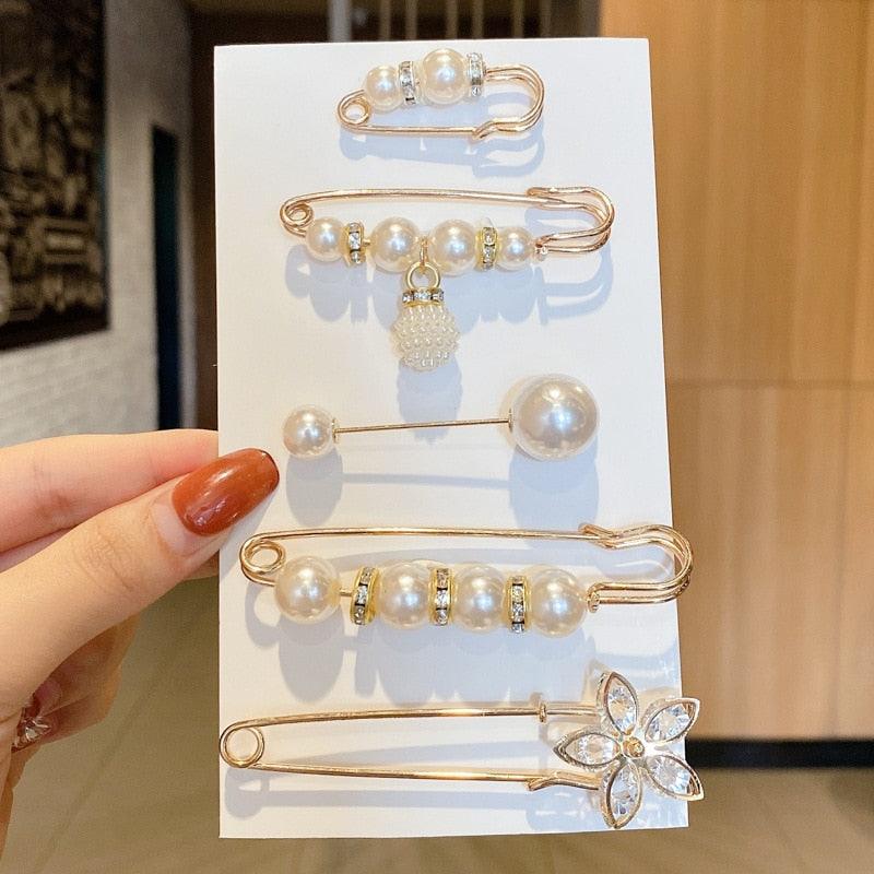 Stevvex gold-tone hair pins with pearls, rhinestones and a flower charm on display card on Tampa Home & Garden Store