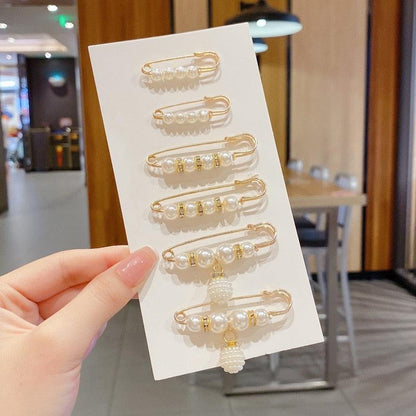 Pearl bead hair pins set in gold-tone with dangling pendant by Stevvex on white display card on Tampa Home & Garden Store