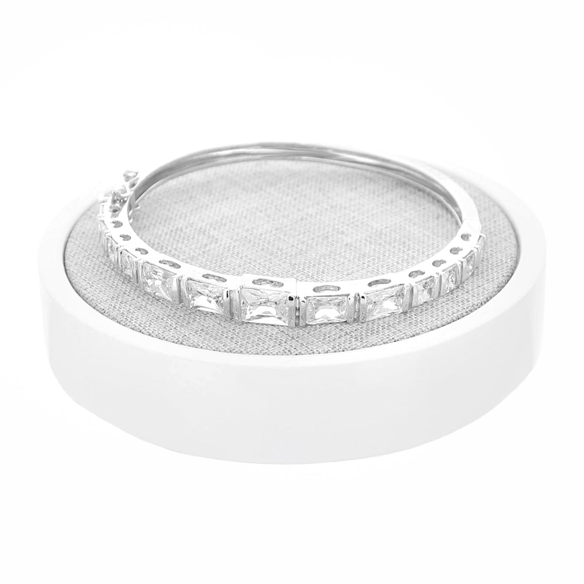 Round jewelry display with gray linen top on white MDF base featuring a silver ring on Tampa Home & Garden Store