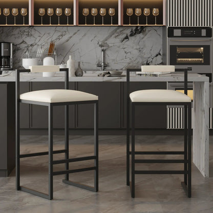 Two counter-height bar stools with black metal frames and padded white seats at island on Tampa Home & Garden Store