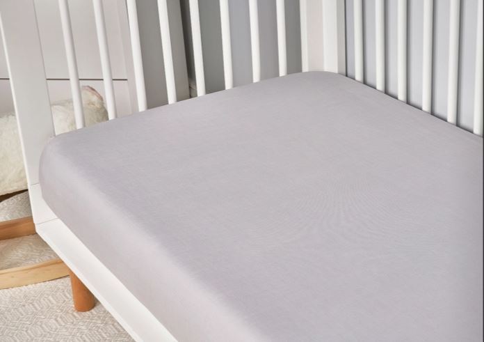 BedGear Hyper-Linen Crib Sheet, light grey fabric on white crib mattress on Tampa Home & Garden Store