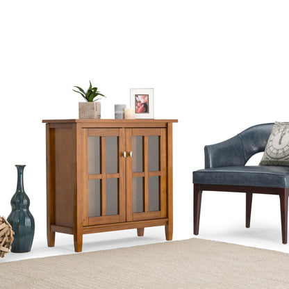 Warm Shaker Handcrafted Low Storage Cabinet with wood finish and glass-front doors, top decor with plant, frame, and candles on Tampa Home & Garden Store