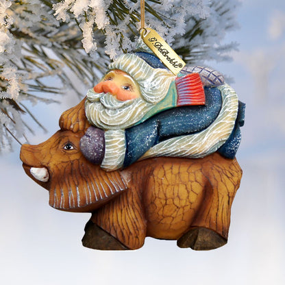 Santa on Boar sculpted ornament by G. DeBrekht, hand-painted holiday decor with blue cloak on Tampa Home & Garden Store