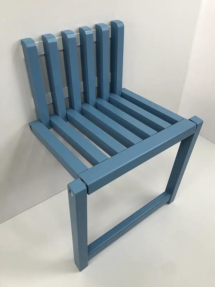 Wall-mounted blue solid-wood folding chair with slatted seat and back on Tampa Home & Garden Store