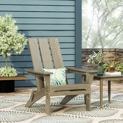 Aurascape foldable Adirondack chairs in weathered gray wood with tropical leaf cushions on patio on Tampa Home & Garden Store