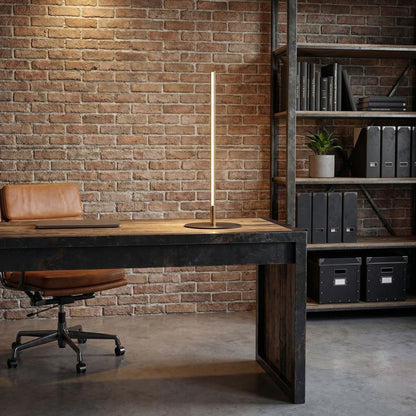 Dimond LED table lamp with on/off switch, gold stem and round base in industrial office setting on Tampa Home & Garden Store