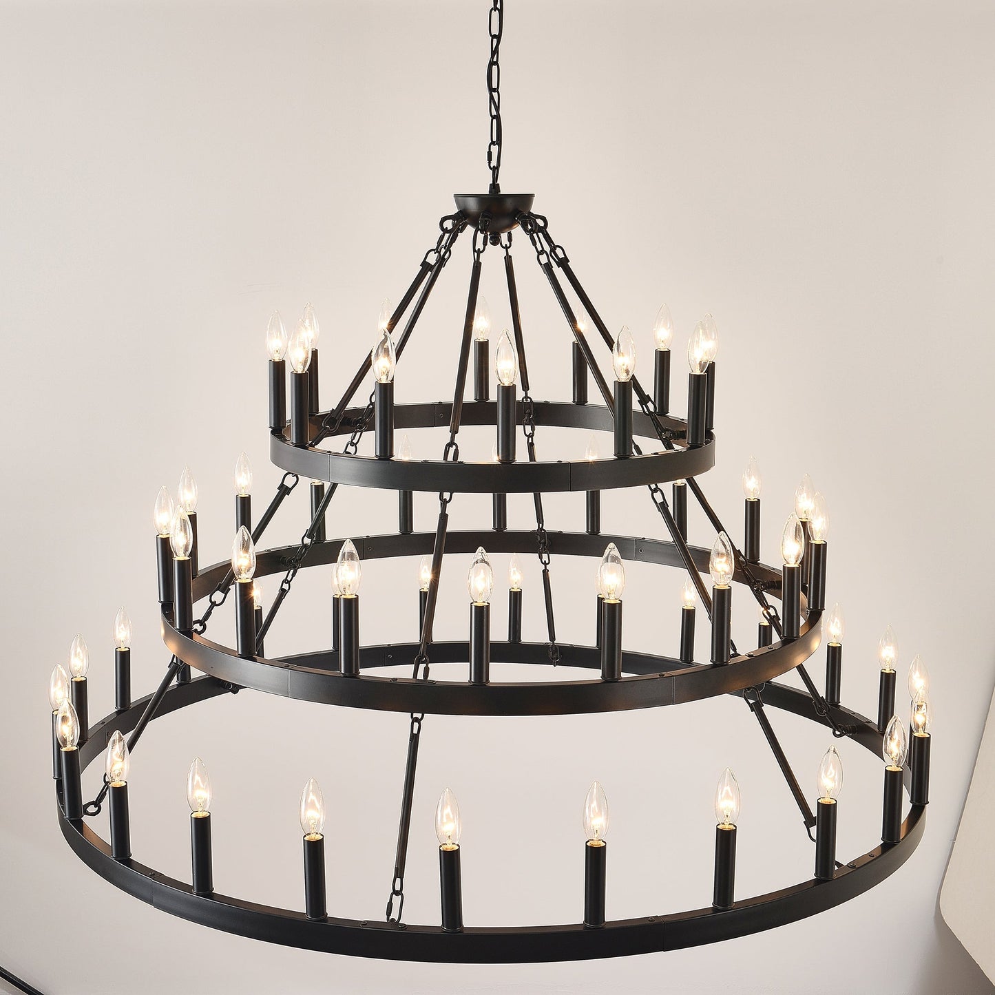 3-Tier Wagon Wheel Chandelier matte black metal with 54 candle bulbs on Tampa Home & Garden Store