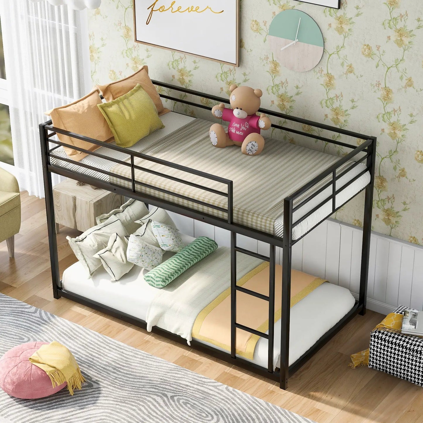 Low metal bunk bed with black frame and ladder, two-tier bunks with bedding and a teddy on bunk on Tampa Home & Garden Store