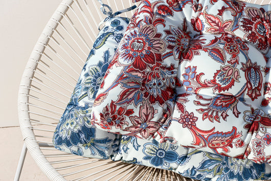 Outdoor bench cushion in blue and red floral fabric for wicker chair on Tampa Home & Garden Store