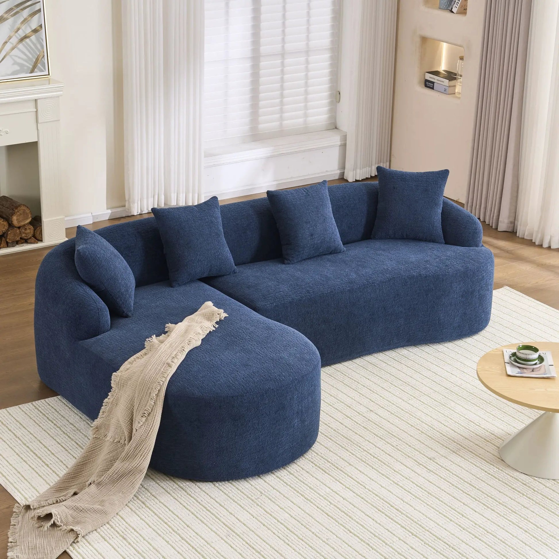 Blue textured fabric combined sofa with 4 pillows in a modern stationary sectional setting on Tampa Home & Garden Store