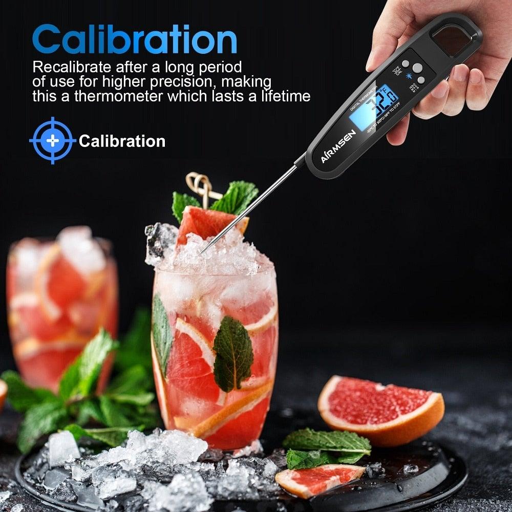 Stevvex digital kitchen thermometer with backlit blue display and stainless probe in a cocktail on Tampa Home & Garden Store