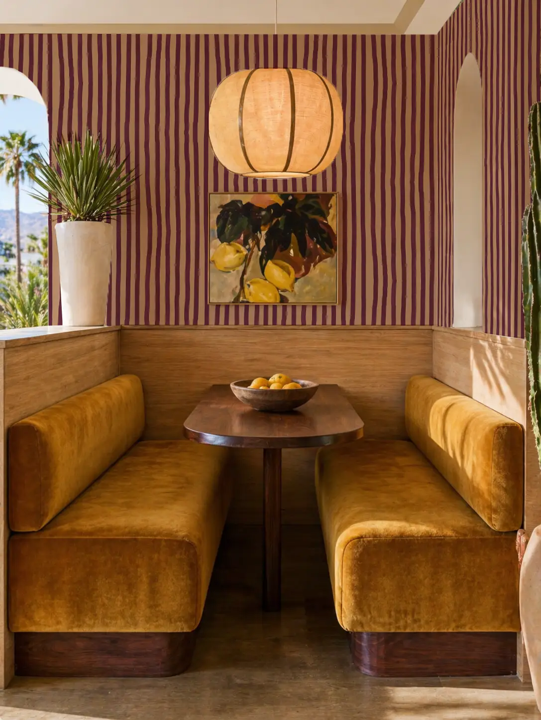 Dolce Stripe Wallpaper peach and eggplant with purple vertical stripes on a cozy dining nook on Tampa Home & Garden Store
