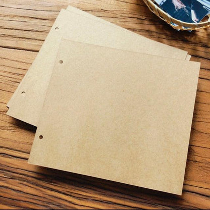 Stevvex kraft brown DIY photo album scrapbook pages, 3-hole punched, sheets visible on wood on Tampa Home & Garden Store