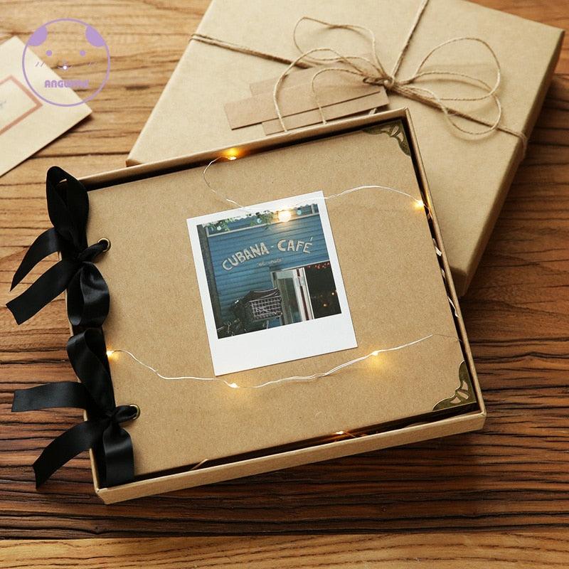 DIY photo album scrapbook by Stevvex with kraft brown cover and black ribbon in a gift box on Tampa Home & Garden Store