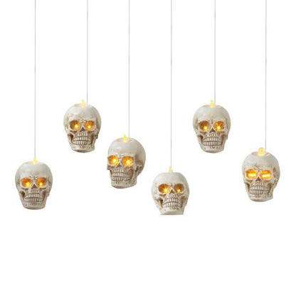 Lighted hanging skulls set of 6, white skulls with glowing amber eyes on Tampa Home & Garden Store