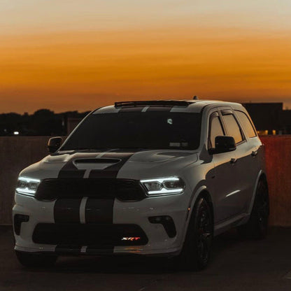 Dodge SRT RGBW Flow Series LED badge emblem on white SUV with black racing stripes on Tampa Home & Garden Store