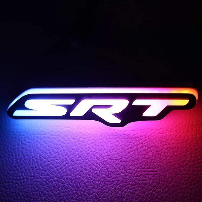 Dodge SRT RGBW Flow Series LED badge emblem glowing with blue to pink gradient on Tampa Home & Garden Store