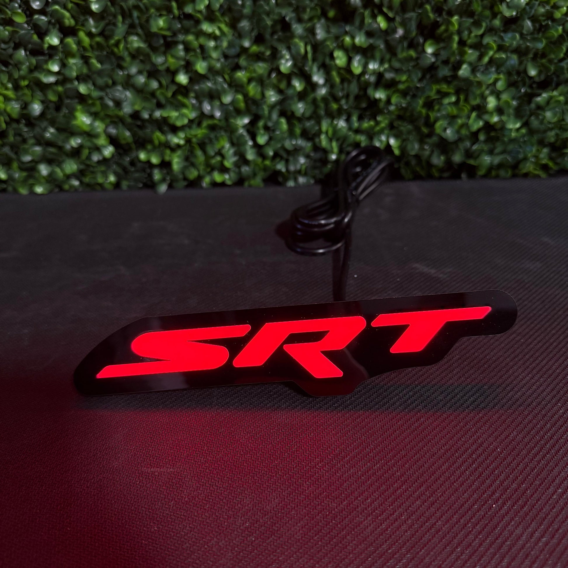 Dodge SRT RGBW Flow Series LED badge emblem from AutoLEDTech.com, red SRT lettering on black on Tampa Home & Garden Store