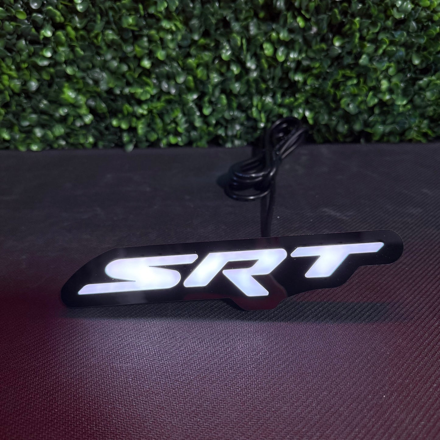 Dodge SRT RGBW Flow Series LED badge emblem with black housing and white illuminated SRT logo on Tampa Home & Garden Store