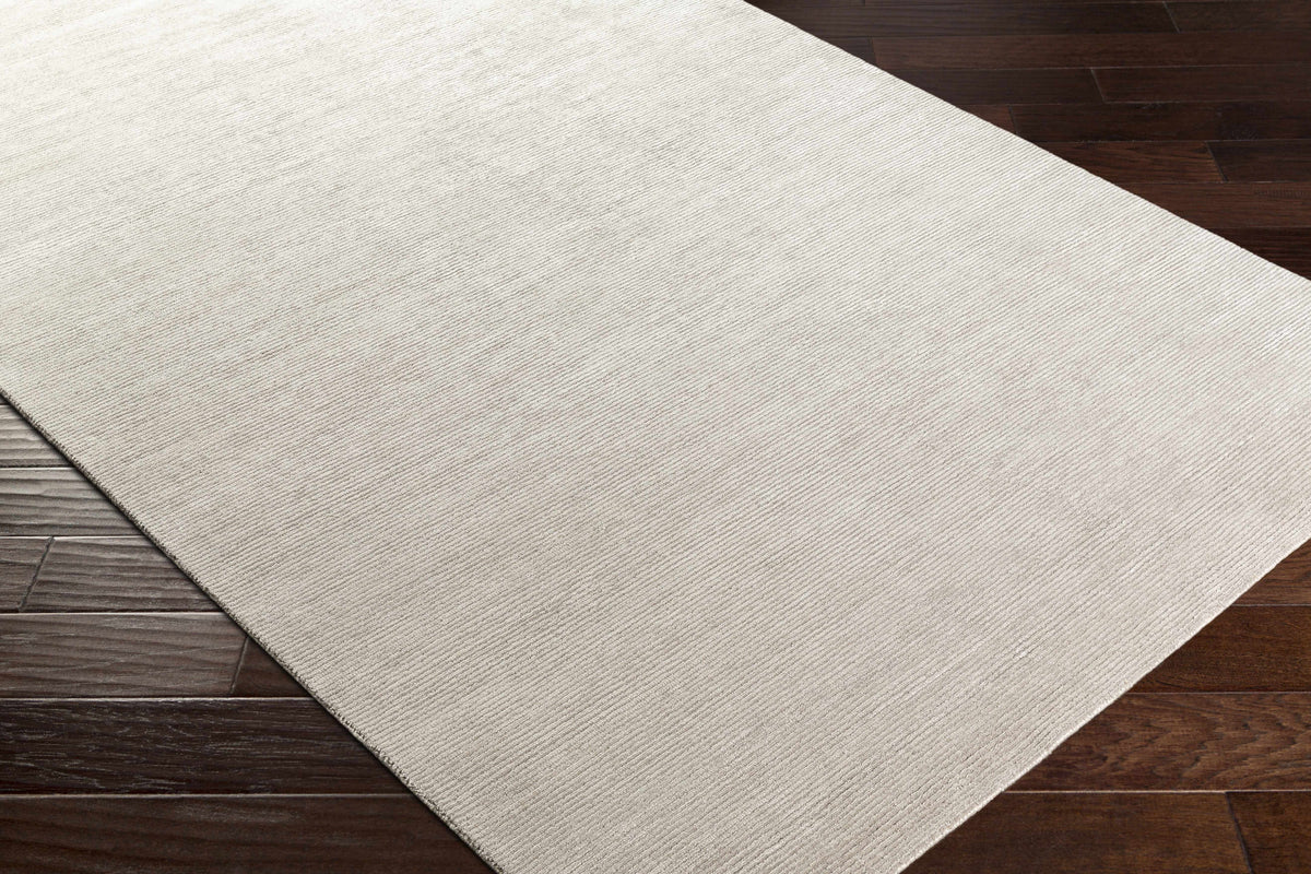 Donegal Carpet Rug beige textured weave by Boutique Rugs on dark hardwood floor on Tampa Home & Garden Store