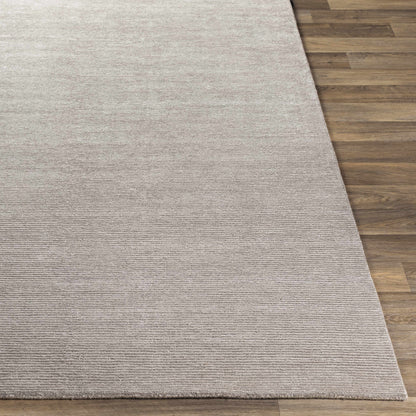Donegal Carpet rug in soft beige with textured loop pile on wood floor on Tampa Home & Garden Store