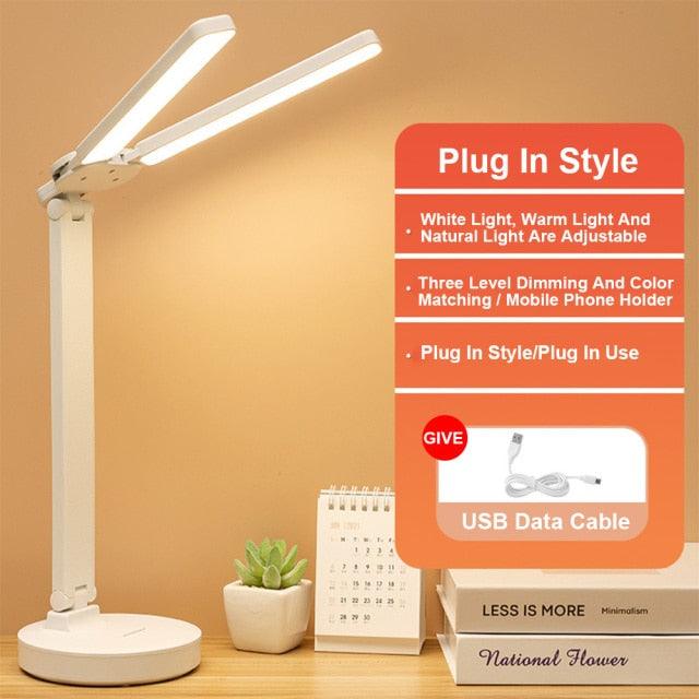 White double lamp cap LED foldable reading lamp with dual adjustable arms on desk on Tampa Home & Garden Store