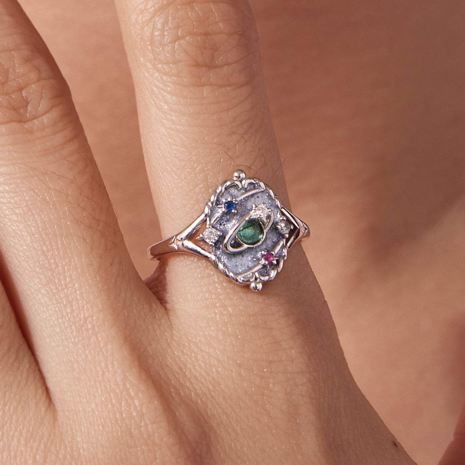 Sterling silver ring with a green center gemstone and blue and pink CZ accents on Tampa Home & Garden Store