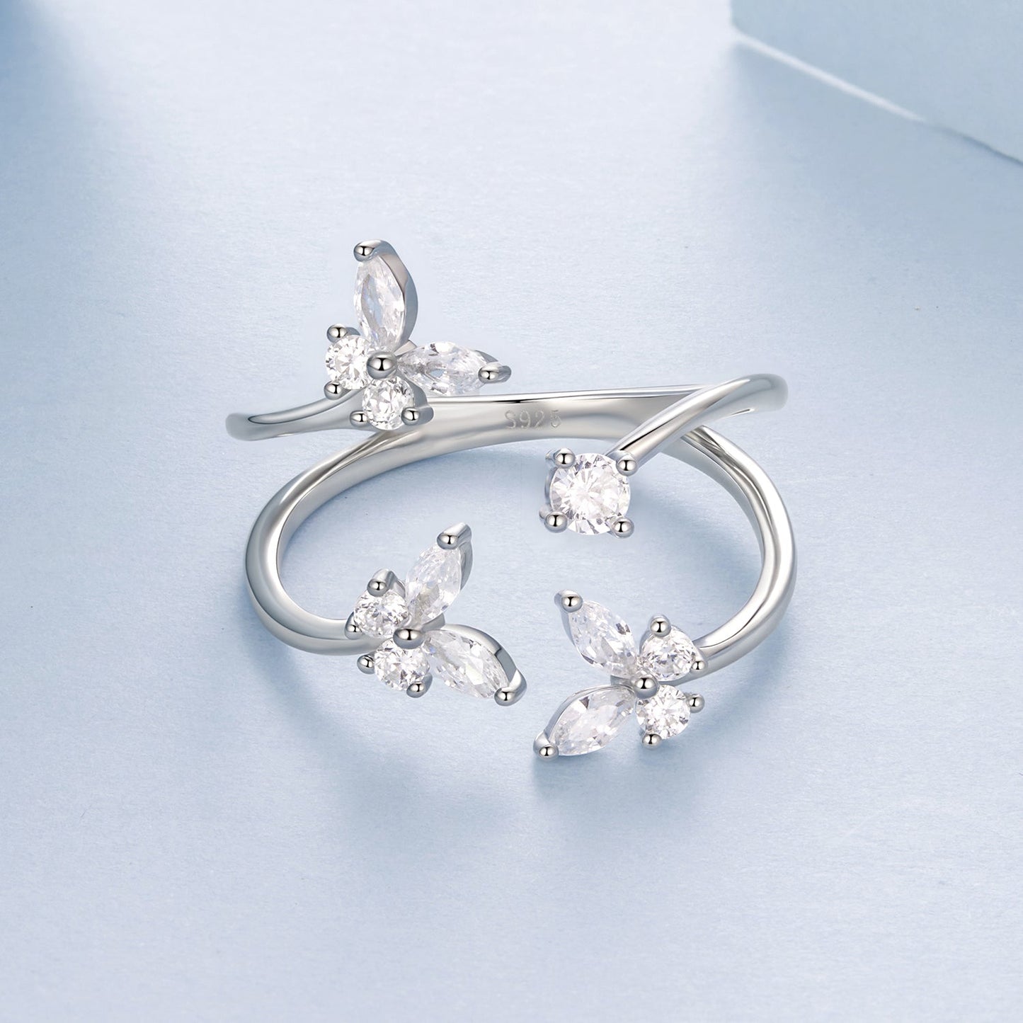 Ring set of three sterling silver pavé CZ flower rings in white gold plating on Tampa Home & Garden Store