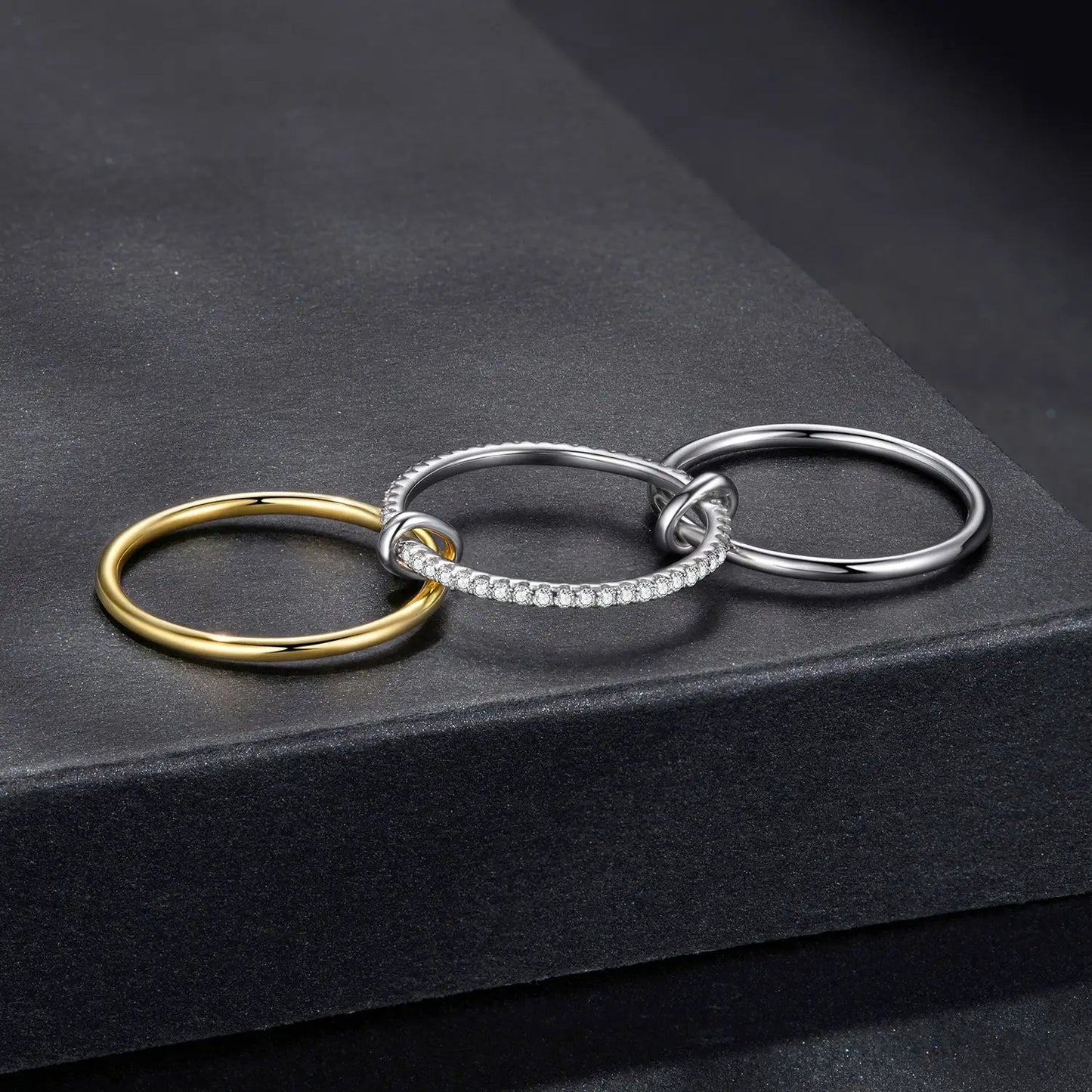 Rings set of 4 interlocking bands in gold and silver finishes with pavé moissanite accents on Tampa Home & Garden Store