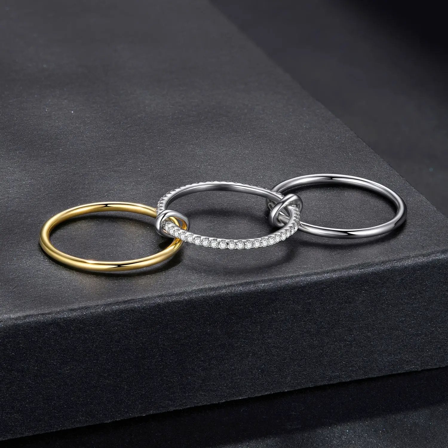 Rings set of 4 interlocking bands in gold and silver finishes with pavé moissanite accents on Tampa Home & Garden Store