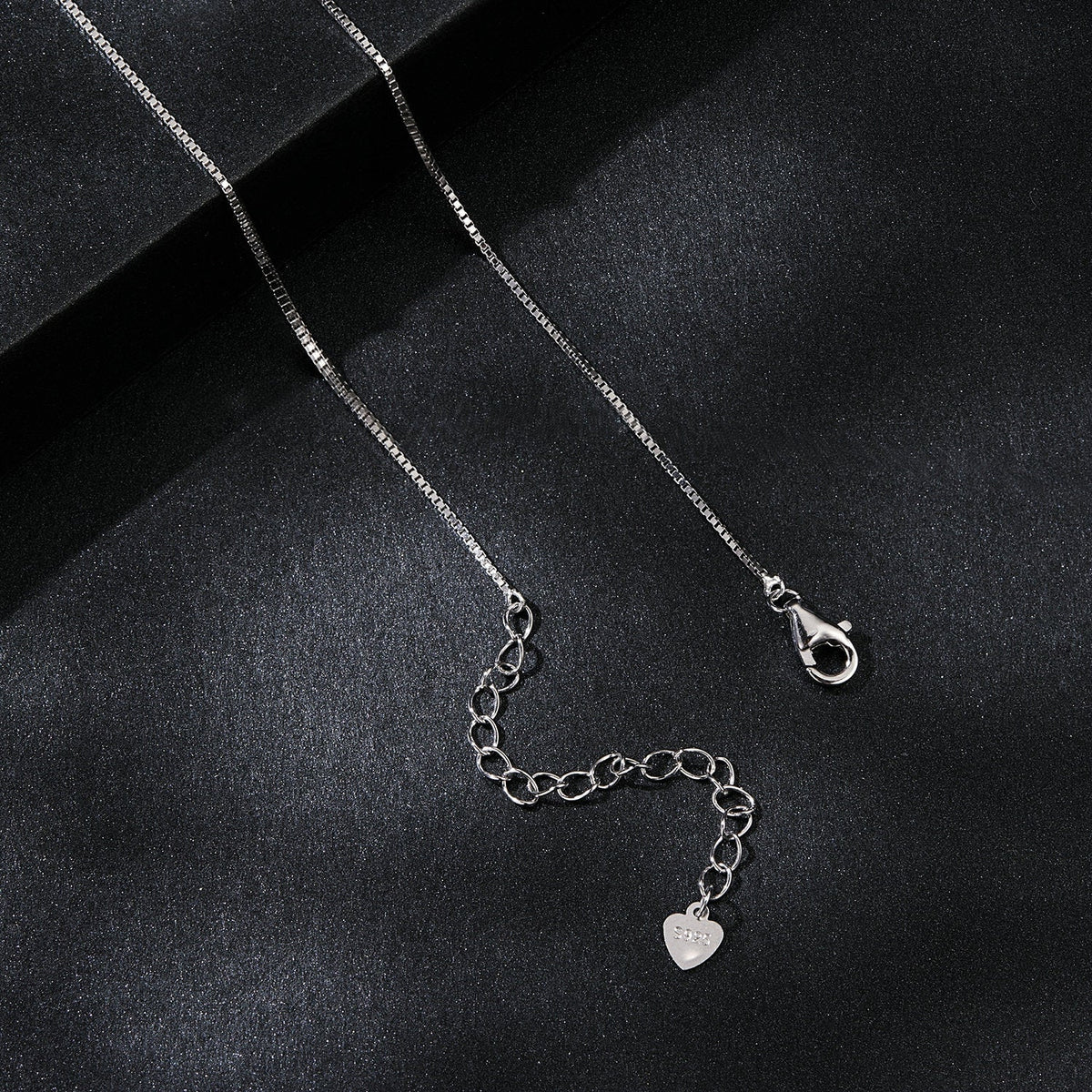 Sterling silver 925 necklace with a box chain, lobster clasp, and heart charm stamped 925 on Tampa Home & Garden Store