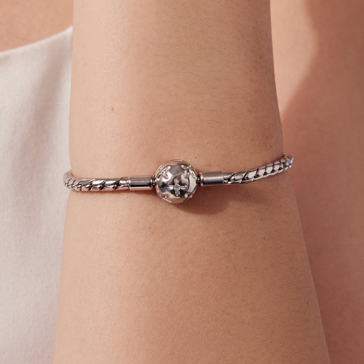 Bracelet 925 sterling silver with white gold plating and CZ floral center on a wrist on Tampa Home & Garden Store