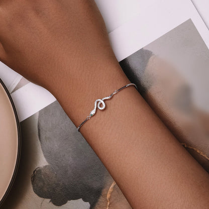 Bracelet S925 silver platinum-plated pavé CZ infinity centerpiece on wrist on Tampa Home & Garden Store
