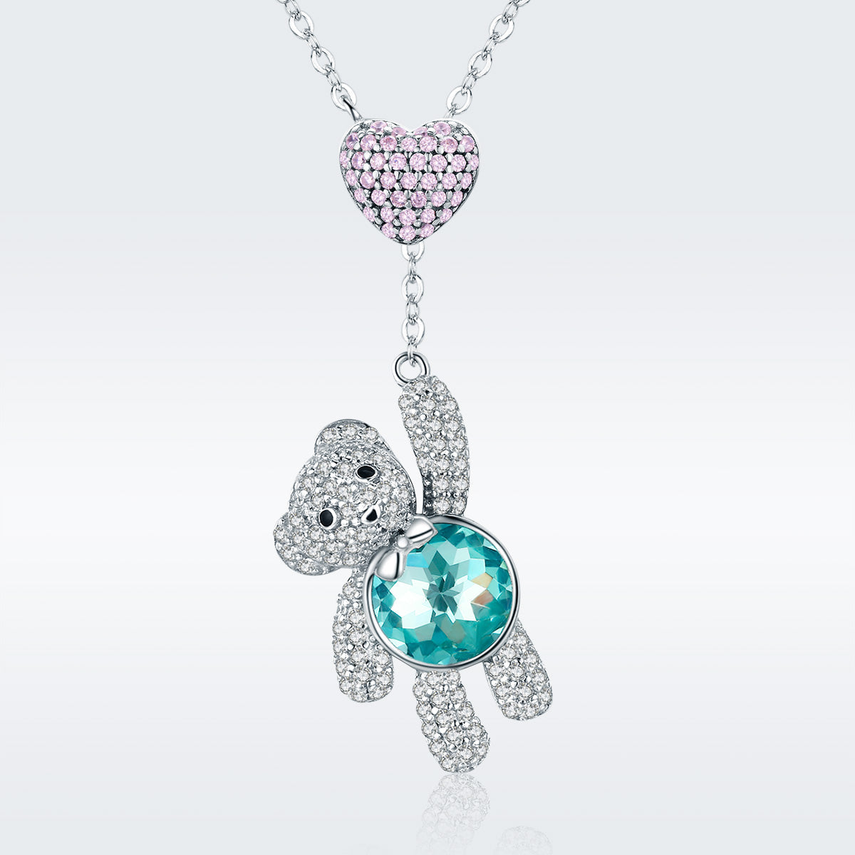 Sterling silver necklace with pink pavé heart pendant and turtle charm with turquoise stone on Tampa Home & Garden Store