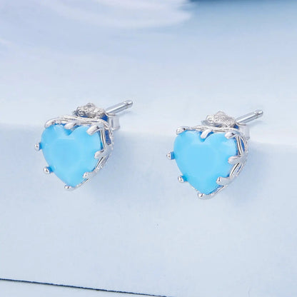 Sterling silver heart stud earrings with sky blue stones and pavé CZ accents on Tampa Home & Garden Store