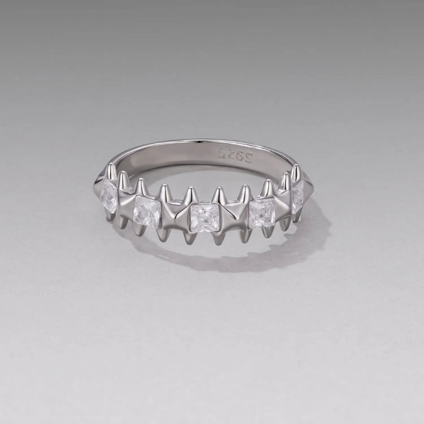 Sterling silver ring with white gold plating and square CZs on a jagged prong band, size 6 on Tampa Home & Garden Store