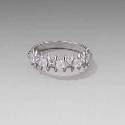 Sterling silver ring with white gold plating and square CZs on a jagged prong band, size 6 on Tampa Home & Garden Store
