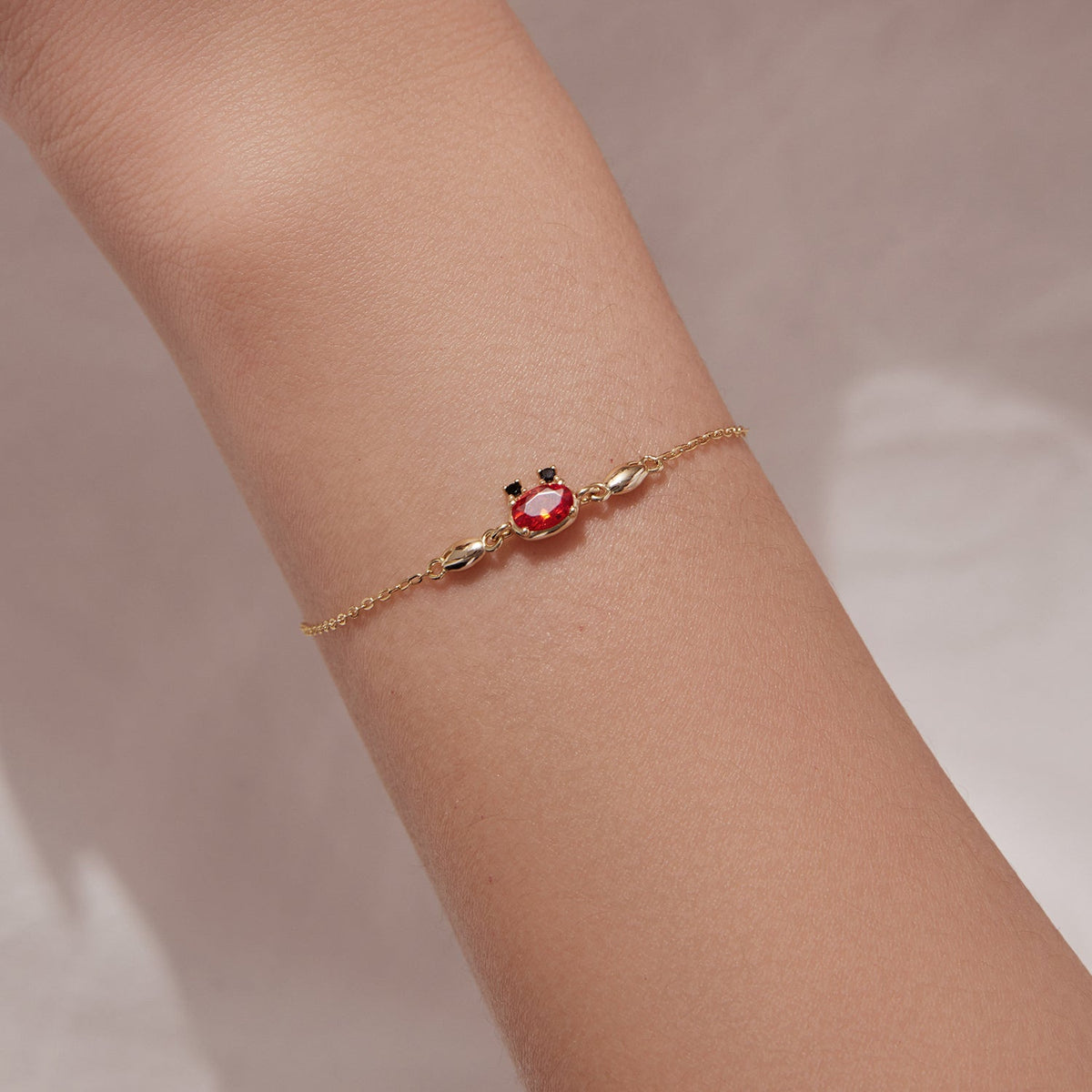 Gold-plated 925 sterling silver CZ bracelet with red center stone, adjustable 15+6 cm on Tampa Home & Garden Store